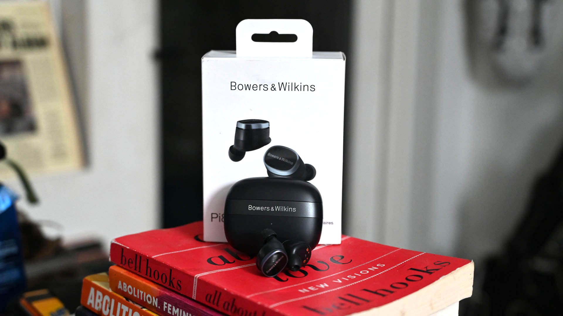 Shot of Bowers & Wilkins Pi8 earbuds with charging case and box