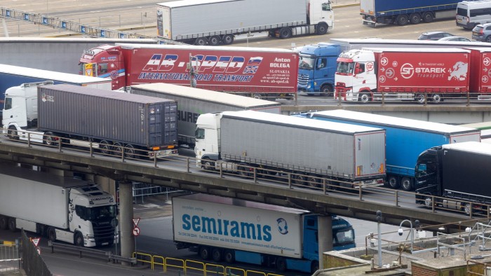 Trucks leave the Port of Dover after disembarking from a ship