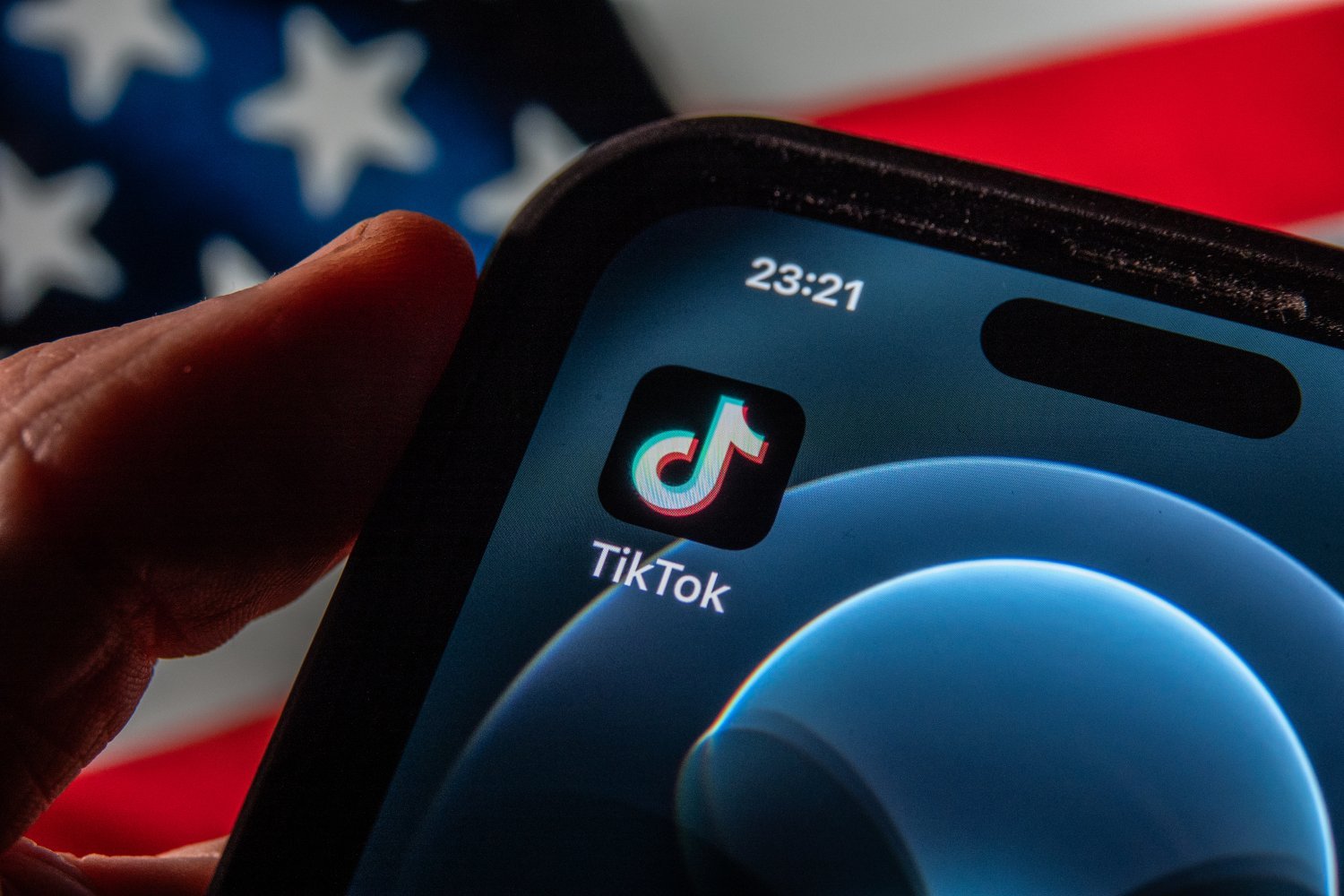 Smartphone screen displays the logo of social media app TikTok