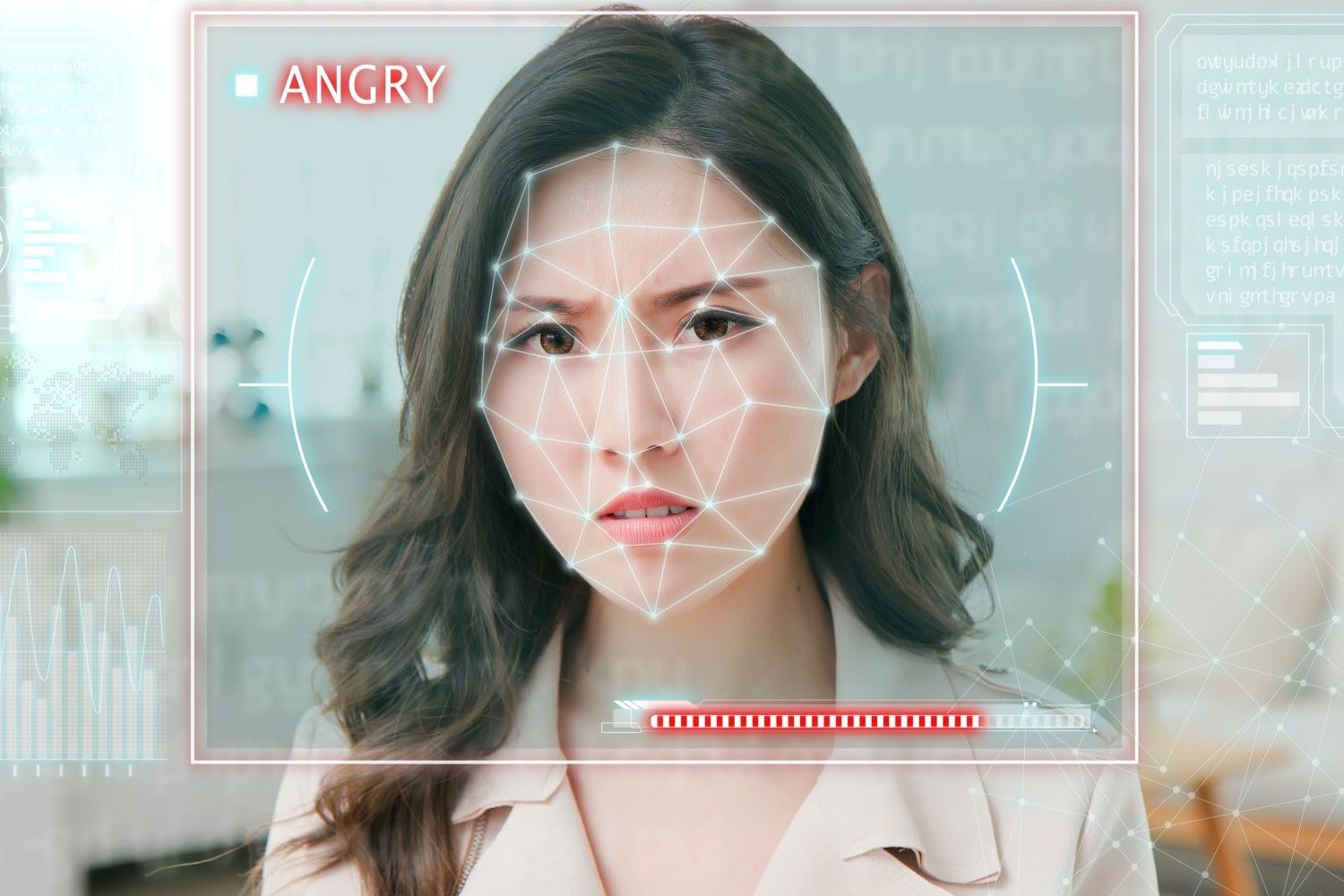 A woman's face overlayed with a graphic representation of an AI facial analysis template. A red label by her face says 'Angry'.