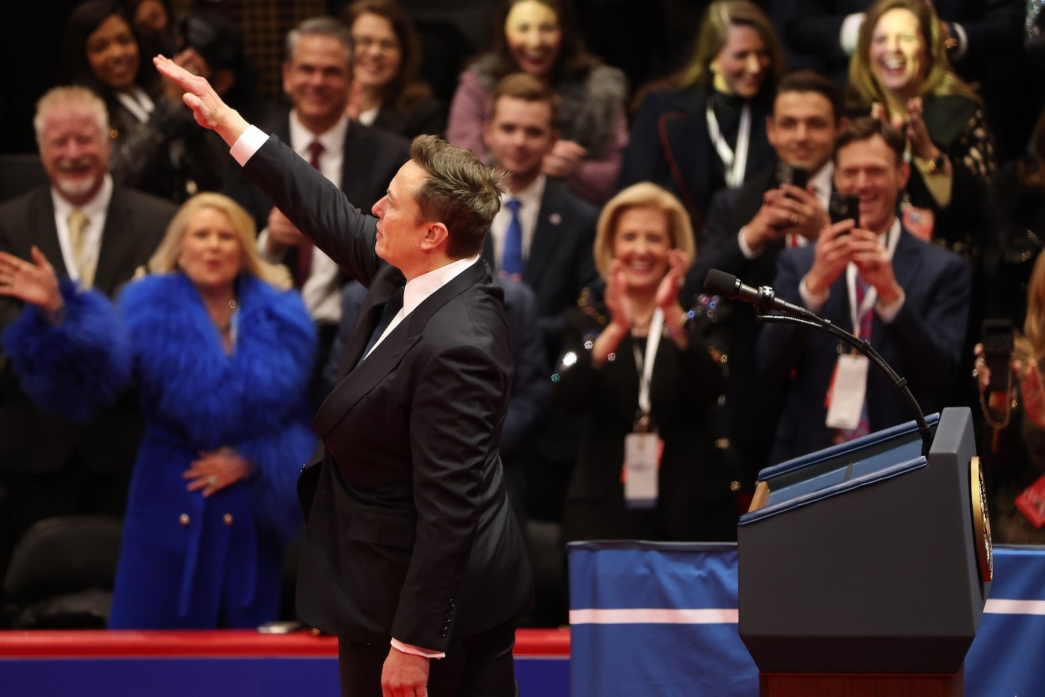 Elon Musk makes what appears to be a Nazi salute during an inauguration event at Capital One Arena on January 20, 2025 in Washington, DC.