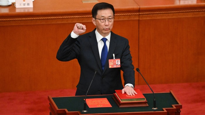 Han Zheng takes an oath after being elected China’s vice-president