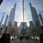 People make their way through the streets of Manhattan during a work day in New York