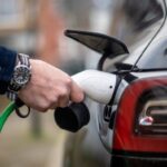 Chris Richmond charges his electric car at home in Bounds Green, North London