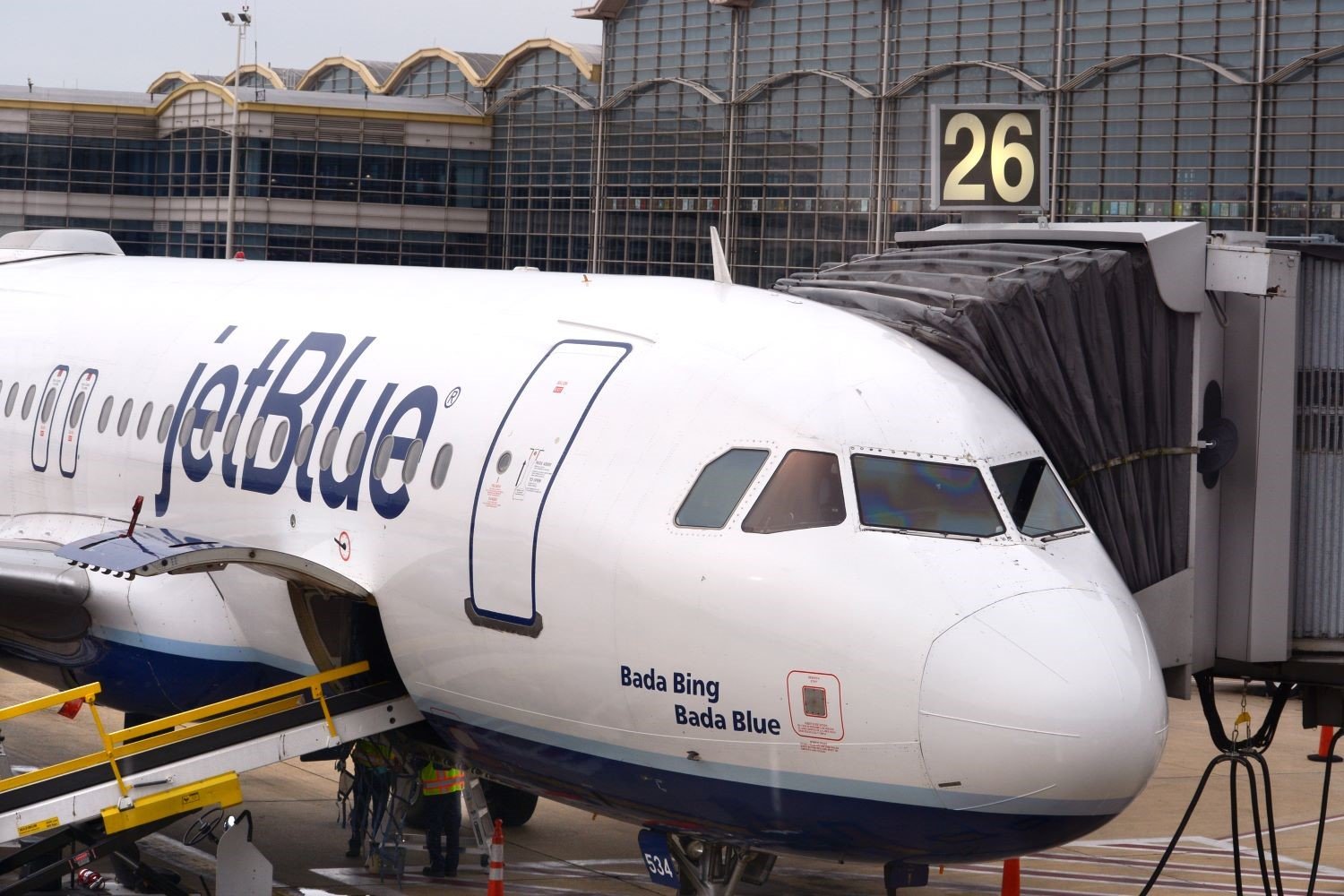 A JetBlue plane parked at gate 26 at Ronald Reagan Washington National Airport.