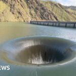 Plughole-like dam creates mesmerising water display