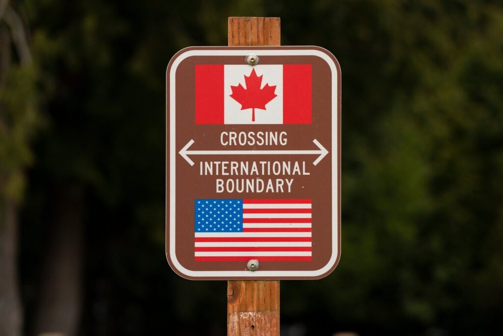 A sign marks the border between the United States and Canada at Peace Arch Park on February 1, 2025 in Blaine, Washington.