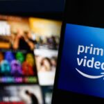 The logo of Amazon Prime Video against a blurred backdrop of tiles on a television screen.