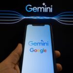 Google and Gemini logo appearing on a smartphone