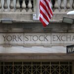 Wall Street closes down, pares losses after Trump delays Mexico tariffs