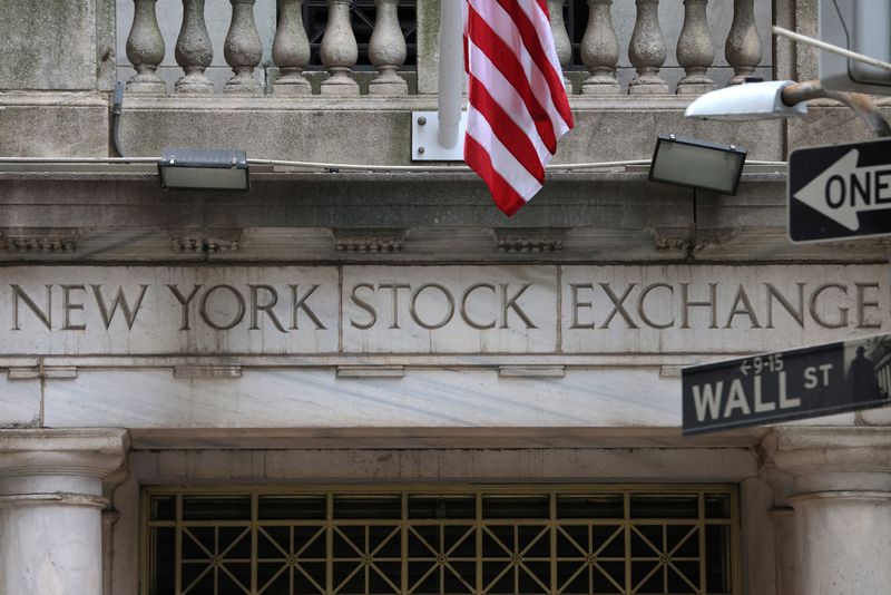 Wall Street closes down, pares losses after Trump delays Mexico tariffs