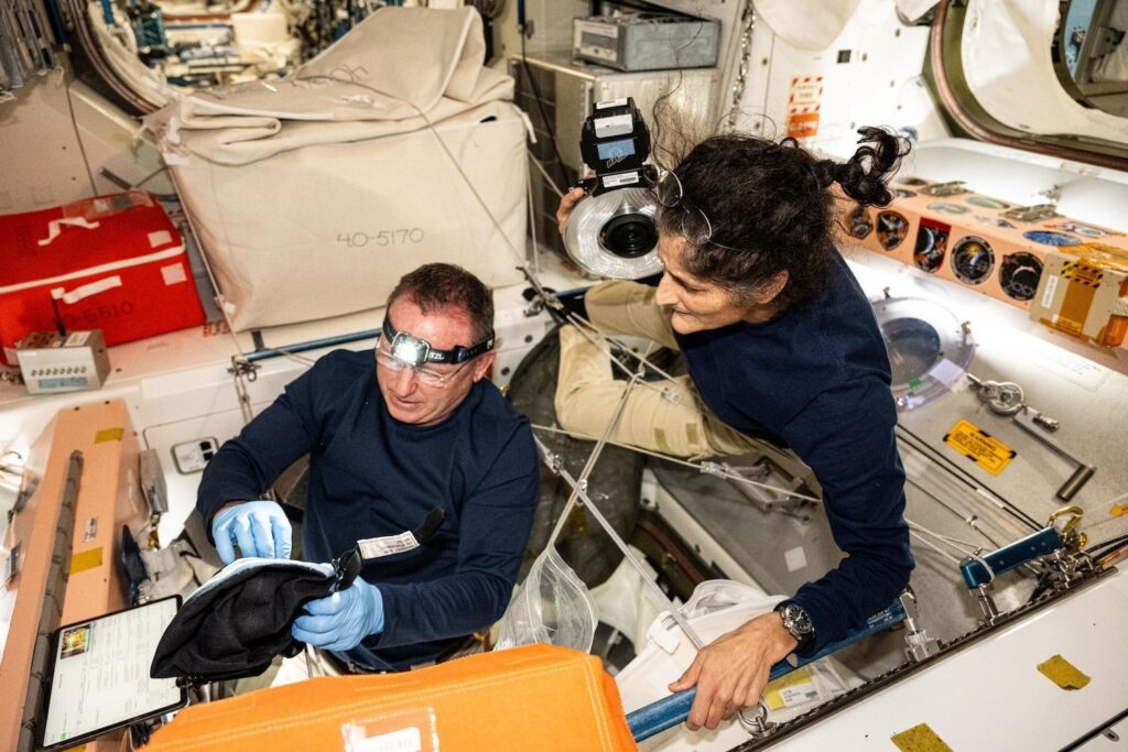 The two Starliner astronauts, Suni Williams and Butch Wilmore, inspect safety hardware aboard the International Space Station.