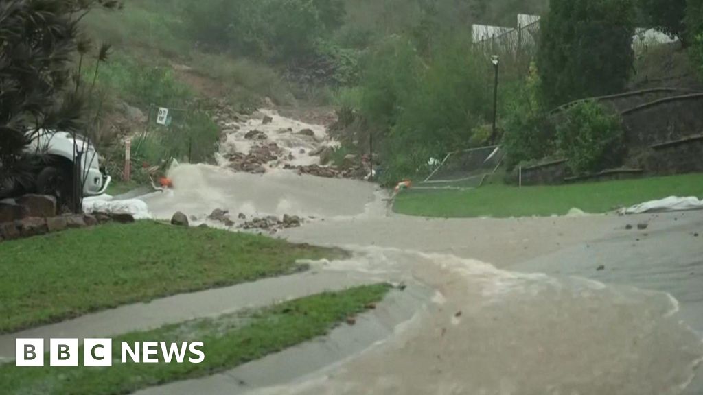 Woman dies in Australian flood as thousands flee homes