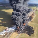 Firefighters tackle large toxic train fire