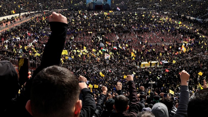 A vehicle carries the coffins of former Hizbollah leaders Hassan Nasrallah and Hashem Safieddine in Camille Chamoun Sports City Stadium