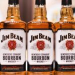 Bottles of Jim Beam Kentucky Straight Bourbon whiskey stand on display during a news conference in Tokyo, Japan