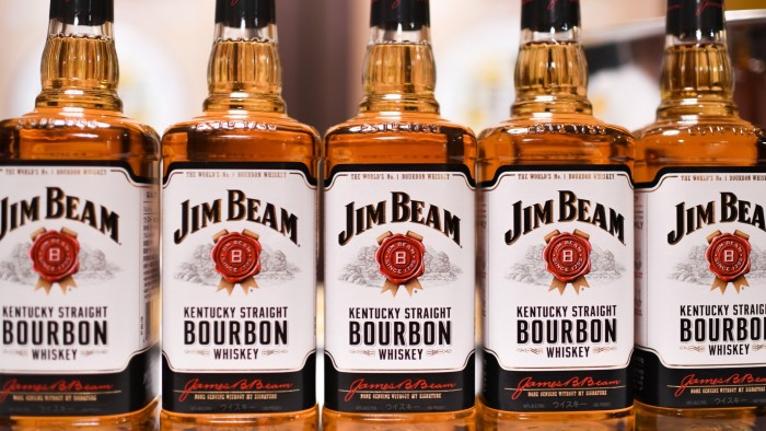 Bottles of Jim Beam Kentucky Straight Bourbon whiskey stand on display during a news conference in Tokyo, Japan