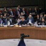 Representatives of the members of the Security Council raise or do not raise their hand to indicate their vote during a Security Council meeting discussing the war in Ukraine at United Nations Headquarters in New York