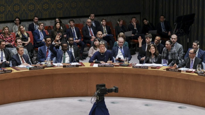 Representatives of the members of the Security Council raise or do not raise their hand to indicate their vote during a Security Council meeting discussing the war in Ukraine at United Nations Headquarters in New York