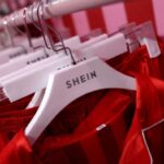 Shein clothing hangs on a rail