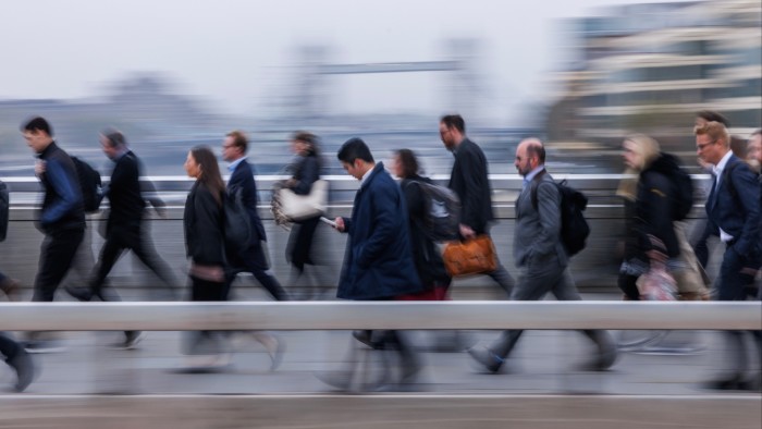 People walking across London Bridge