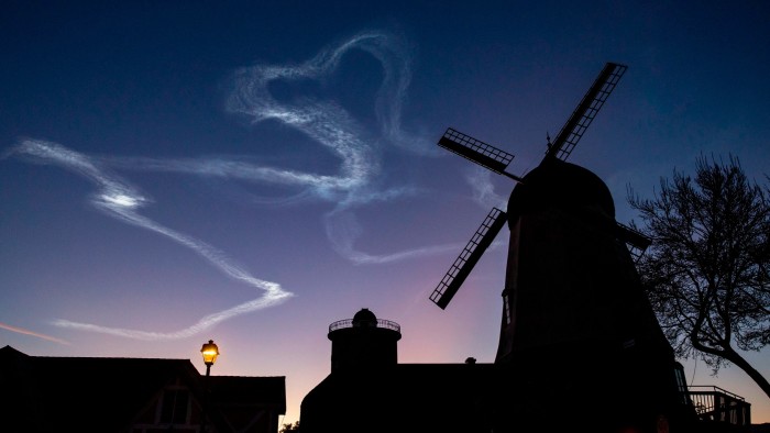 SpaceX launches a pre-dawn (under a crescent moon) a Falcon 9 rocket in Lompoc, California