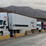 Tractor trailers wait in line at the Otay Mesa Port of Entry, on the US-Mexico border in Tijuana, Baja California, Mexico