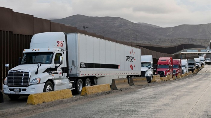 Tractor trailers wait in line at the Otay Mesa Port of Entry, on the US-Mexico border in Tijuana, Baja California, Mexico