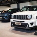 Jeeps on display in a car dealership in Milan