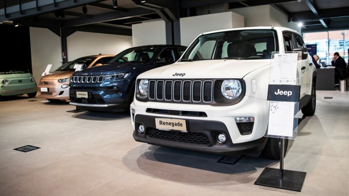 Jeeps on display in a car dealership in Milan