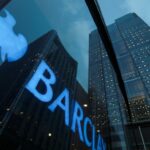 Barclays sign in the window of its offices in Canary Wharf, London, England