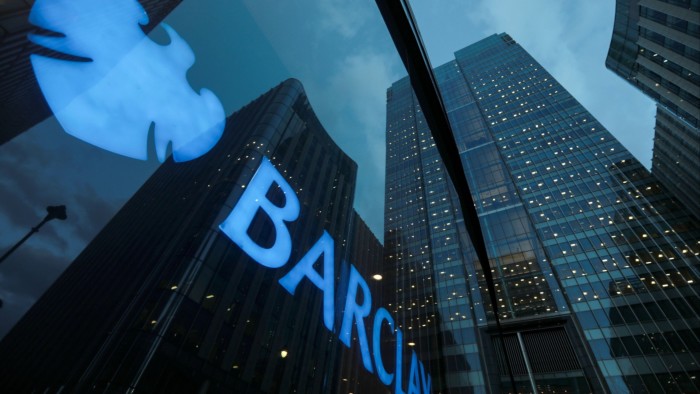 Barclays sign in the window of its offices in Canary Wharf, London, England