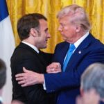 Emmanuel Macron, left, and Donald embrace at the end of a joint press conference at the White House on Monday