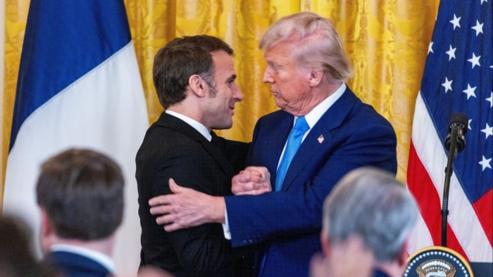 Emmanuel Macron, left, and Donald embrace at the end of a joint press conference at the White House on Monday