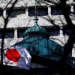 The Japanese national flag is hoisted atop of the Bank of Japan