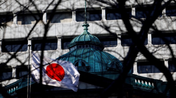 The Japanese national flag is hoisted atop of the Bank of Japan