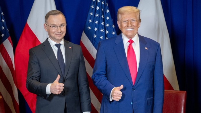 Poland’s President Andrzej Duda, left, and Donald Trump give thumbs-up gestures at the CPAC gathering in Maryland on Saturday