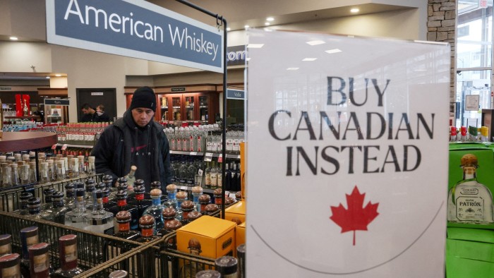 A ‘Buy Canadian Instead’ sign in a shop window