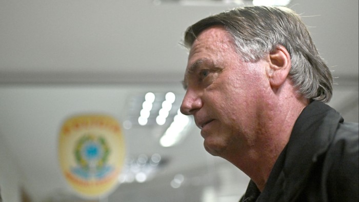 Jair Bolsonaro arrives for a meeting with parliamentarians at the Senate in Brasilia on Tuesday