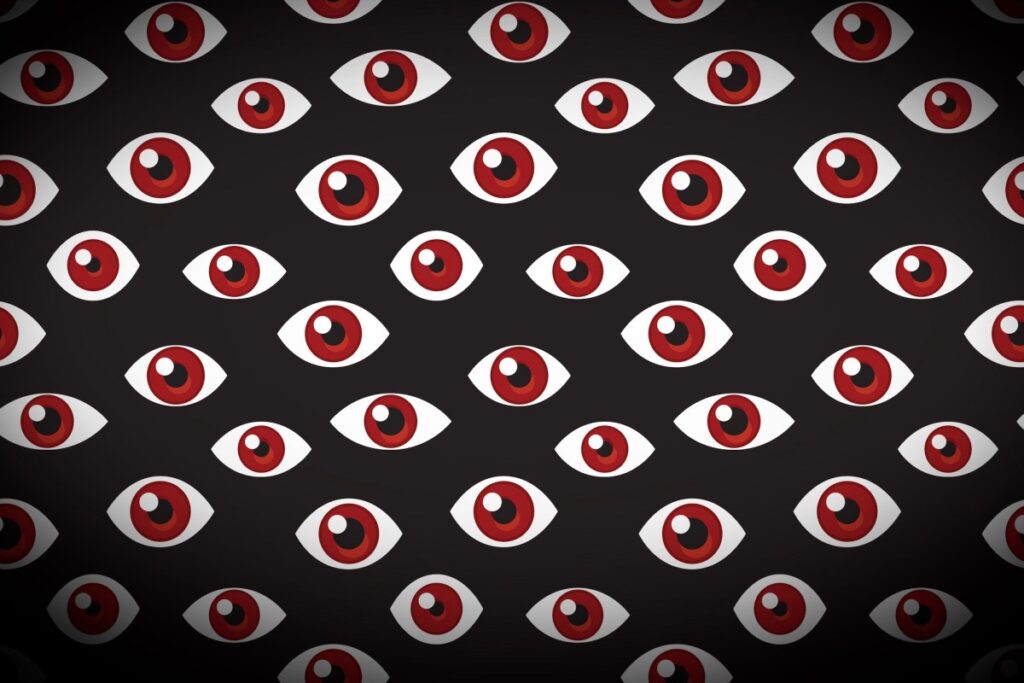 a series of floating eyes on a darkened background