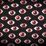 a series of floating eyes on a darkened background