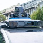 A Waymo self-driving car is seen in the Inner Richmond neighborhood of San Francisco, California, with the Lidar unit on the vehicle visible, November 17, 2024.