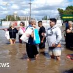 Residents flee homes in flooded Argentine city