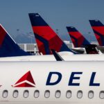 Delta Air Lines slashes earnings outlook, sending shares down