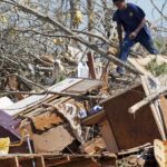 Mississippi couple huddle with huskies in Toyota while windows explode as storm that spawned tornadoes, dust storms and wildfires kills at least 39