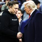 U.S. oligarch Elon Musk shakes hands with President Donald Trump while attending the NCAA Division I Wrestling Championship on March 22, 2025 in Philadelphia, Pennsylvania.