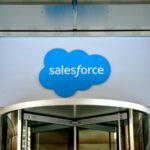 Close-up view of the logo at the entrance to the Salesforce office located at 111 West Illinois Street in Chicago, Illinois, January 2019.