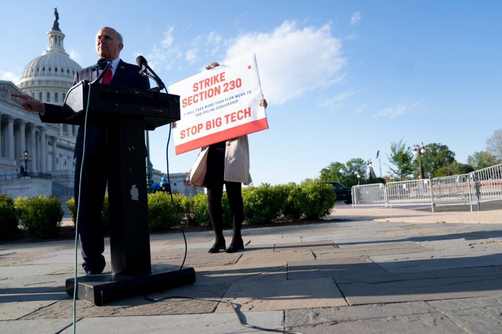 US Representative Louie Gohmert speaks during a news conference on Section 230 outside the US Capitol, in front of a sign that reads 'Strike Section 230' and 'Stop Big Tech'