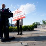 US Representative Louie Gohmert speaks during a news conference on Section 230 outside the US Capitol, in front of a sign that reads 'Strike Section 230' and 'Stop Big Tech'