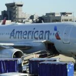 American Airlines plane catches fire at Denver airport, sending 12 people to the hospital